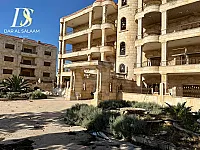 حلب: بيع أرض مع بناية 4 طوابق طابو نظامي قبر الانكليزي