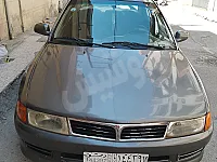 سياره مستوبيشي لانسر موديل سنه 2000 كامله بدون فتحه سقف 