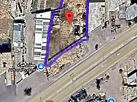 ارض بواجهة 60متر بموقع استراتيجي بجانب التاون سنتر على الطريق مباشرة