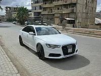 أودي A6 S-Line 2014 - محرك V6 سوبر تشارج ، نظام دافع رباعي ( كواترو )