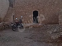 دار عربية غرفتين مساحة 1350 متر تقع في ريف معرة النعمان قرية جرادي 