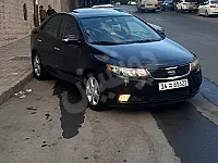 كيا سيراتو 2009 أسود أوتوماتيك للبيع في مساكن برزة