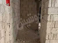 شقة على العضم شارع الكورنيش التل واصلها سواد كهرباء وصحية